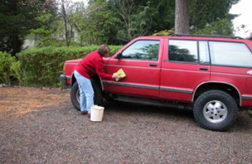 Woman washing her car