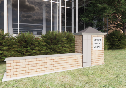 A brick monument sign bench located in front of the Library, providing a charming outdoor seating area.