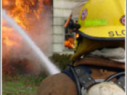 Fire fighter putting out a fire