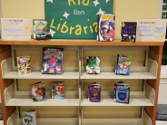 Children's display with books and a couple of posters.