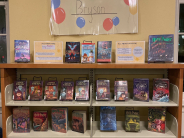 A bookshelf with books on display