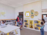 Illustration of the Children's Library at Camas Public Library, highlighting the "Kid Librarian" picks for young readers.