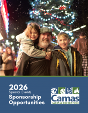 Family in front of downtown Holiday Tree