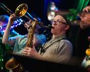 River City Riot playing sax and trombone