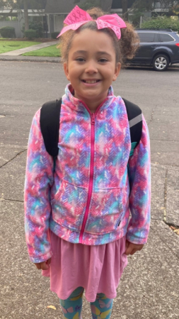 Picture of a girl wearing pink.