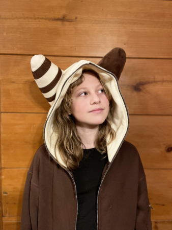 Aolagi in a hoodie with creature ears looking up and to her right.
