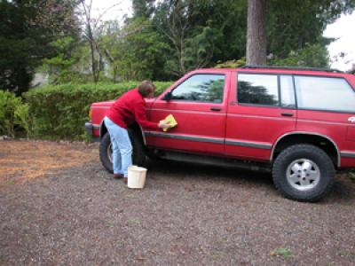 Woman washing her car