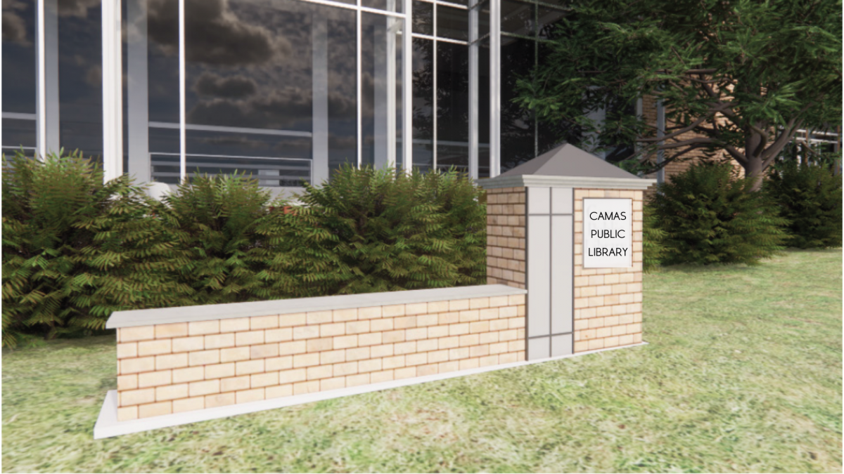A brick monument sign bench located in front of the Library, providing a charming outdoor seating area.